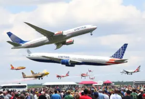 Airshow with vintage warbirds and a United Airlines Boeing 777 at Ellington Airport