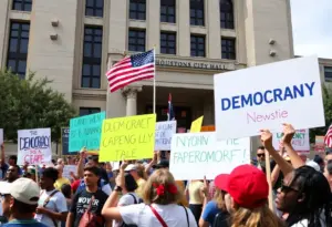 Participants of No Kings protests in Houston demonstrating for democracy.