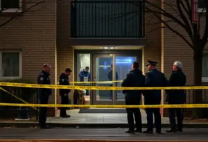 Police investigation at an apartment complex in Houston after a robbery shooting.