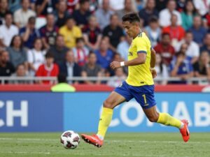 Defensive soccer player in action on the field, representing Houston Dynamo FC.