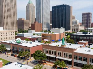 Houston skyline with businesses engaged in ethical practices.