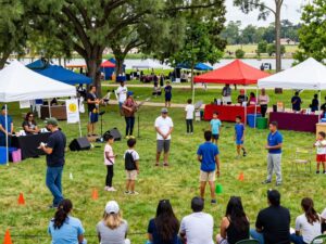 Community members enjoying various activities at a Lake Houston event