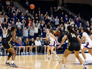Intense action during the Sam Houston Bearkats vs SMU Mustangs women's basketball game at Johnson Coliseum.