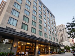 Exterior view of Staybridge Suites Houston I-10 West with Houston skyline