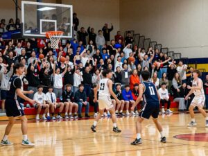 Anderson Trojans and McCallum Knights compete in a high school basketball game