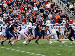 Bryan High School football players in action on the field during a game.
