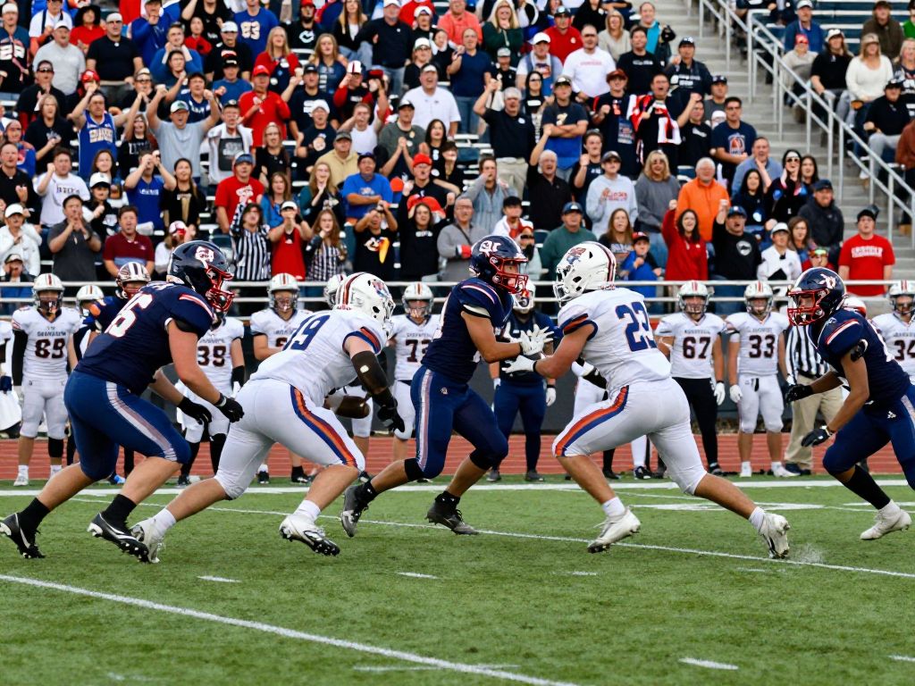Bryan High School football players in action on the field during a game.