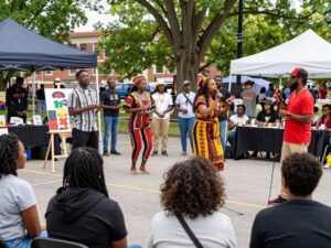 Community gathering celebrating Black History Month with art and performances