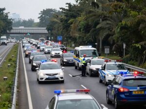 Scene depicting traffic accident on Galveston causeway with police presence.
