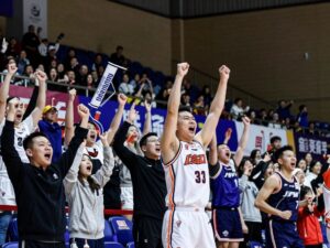 Fans cheering at a basketball game in Houston