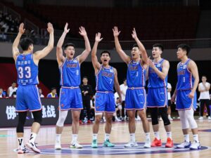 Houston Cougars basketball team reveals blue uniforms during the game.
