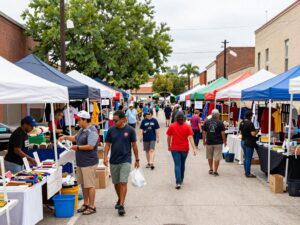 Local marketplace in Houston with small business shops and community involvement