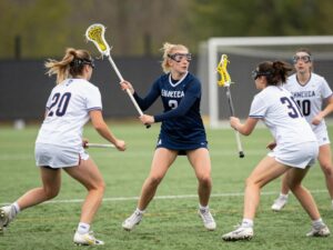 Action shot of a women's lacrosse game in progress