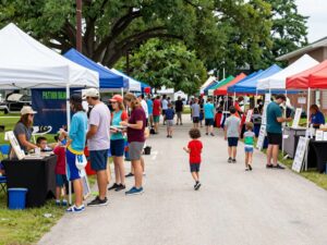 A lively scene from New Caney's community events with various activities and attendees.