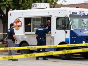 Crime scene at taco truck in Houston, police tape visible