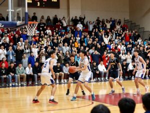 High school basketball players competing in a district game