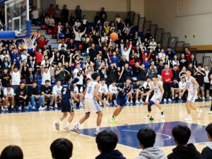 High school basketball players in action during a game