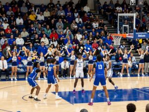 Action shot of a high school basketball game in Dallas with players and spectators