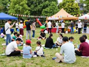 Community gathering in Houston featuring local artists and various activities.