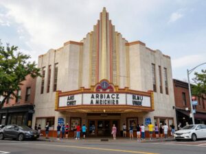 Community members gathering to protest the demolition of the Garden Oaks Theater.