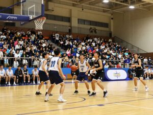 Haltom Buffalos and Sam Houston Texans high school basketball teams playing in a basketball game