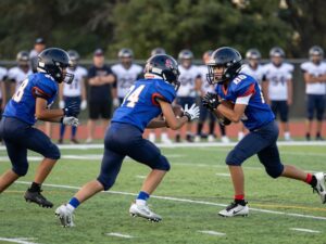 Young athletes playing in a Houston high school football game.