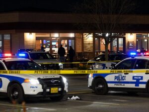 Police presence in the parking lot of a Houston restaurant after a shooting incident.
