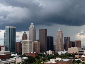 Dark storm clouds above Houston skyline as a storm approaches.
