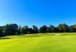 Kiara Romero celebrating her collegiate golf victory.