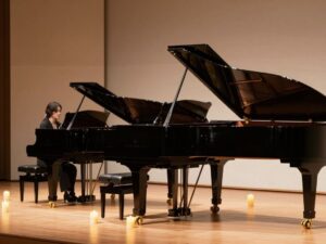 Piano concert setting at Chapelwood UMC with two pianos and candlelight.