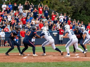Memorial High School athletes in action during a football and baseball game.