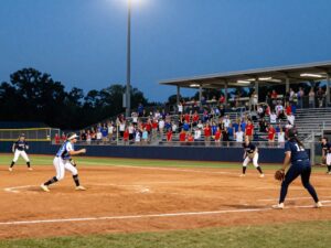 High school softball game in Northeast Mississippi with players and fans