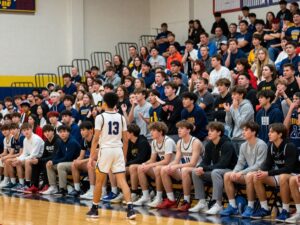 Crowd at Splendora High School basketball game reacting to an incident