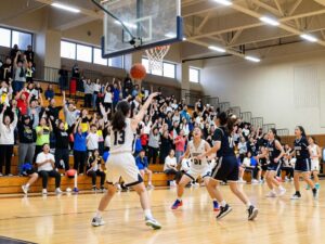 Young female athletes playing basketball during Texas UIL playoffs