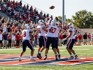 High school football players celebrating during a game