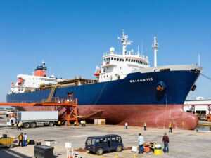 Workers at the Texas Gulf Coast shipyard engaged in shipbuilding activities.